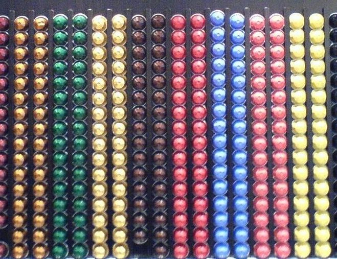 Rows of colored Nespresso OriginalLine aluminum capsules